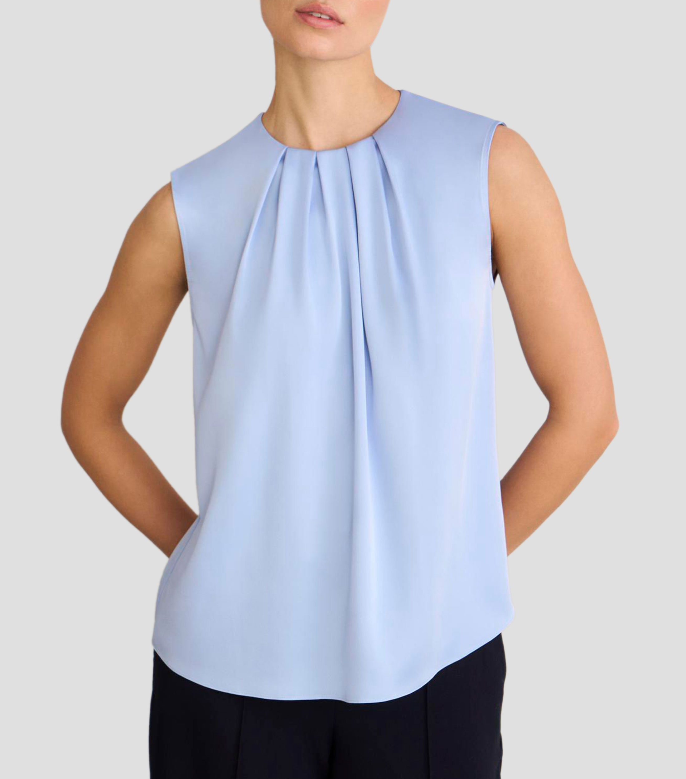 Blusa lisa sin mangas Mujer